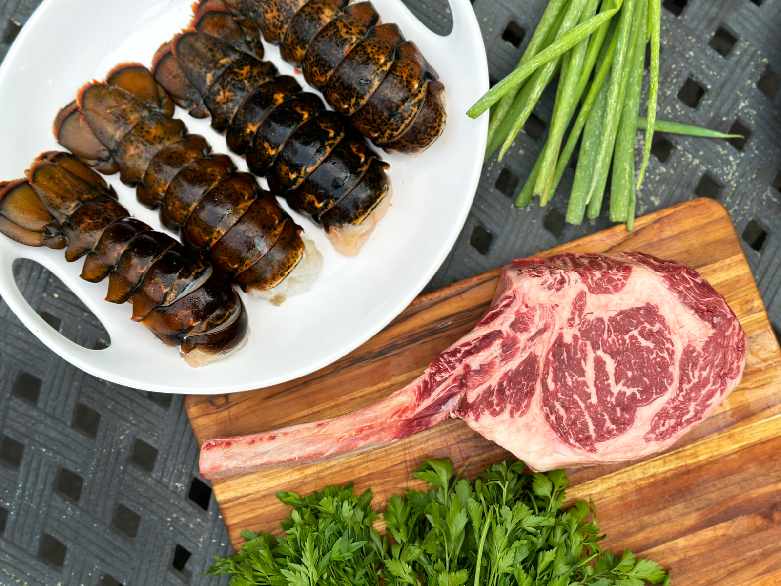 Surf 'N Turf - Tomahawk, NY Strip OR Ribeye and Maine Lobster Tails